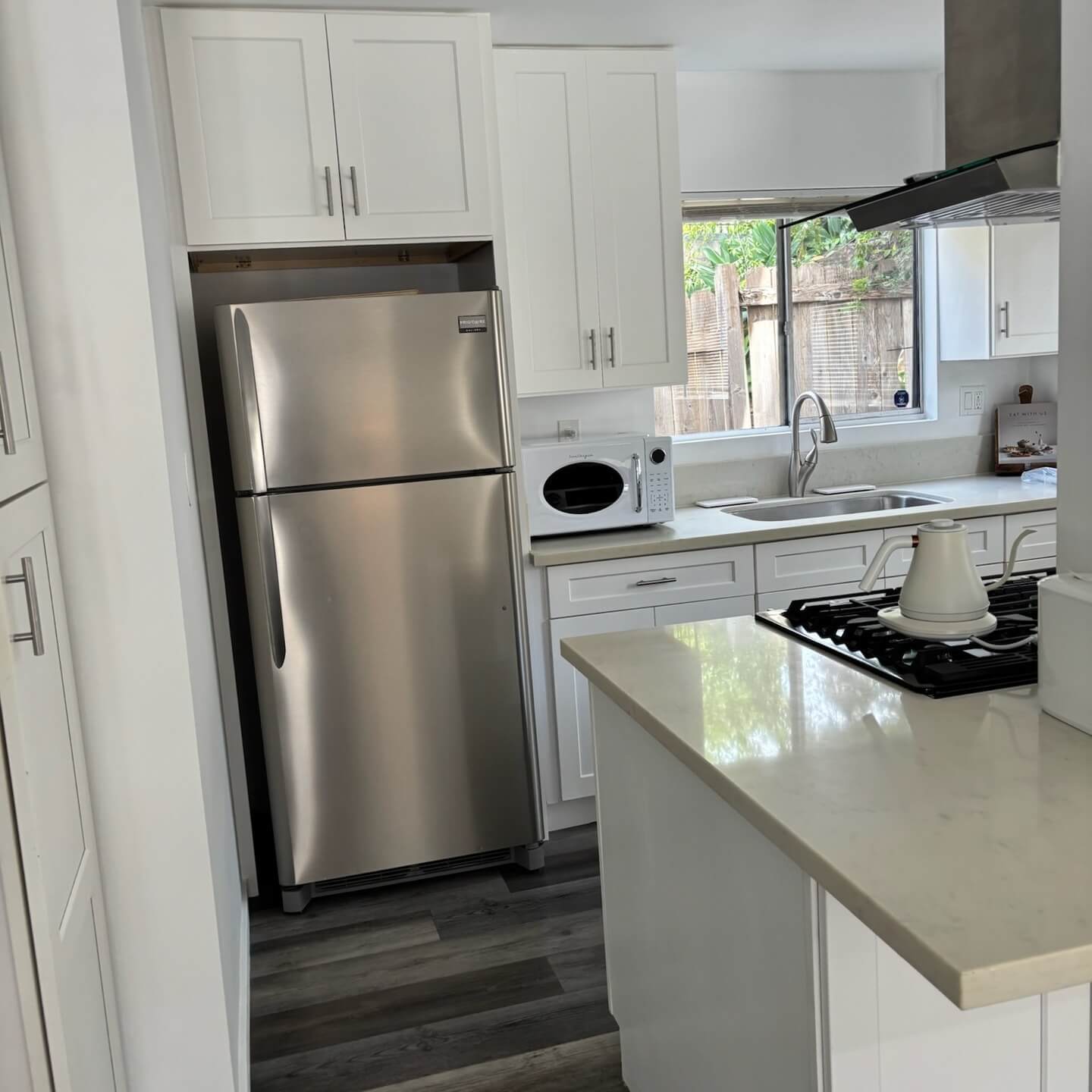 Bright, polished kitchen after a Coastal House Cleaning visit